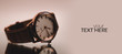 © gmstockstudio - Elegant wrist watch closeup on dark