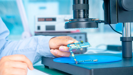  Woman worker in laboratory of electronics devices