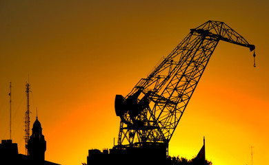 silhouette of crane at sunset