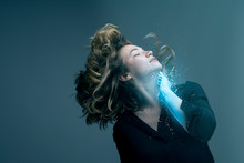 Woman With Flying Hair And Hand Transforming Into Ice In A Virtual Reality