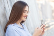 © bokan - Young beautiful woman using smartphone
