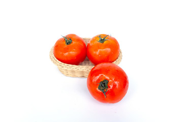 Close up red tomatoes isolated on white background.Tomatoes are vegetables that contain vitamin C and A. And also have anti-oxidants such as lycopene Beta-carotene and phosphorus as well.