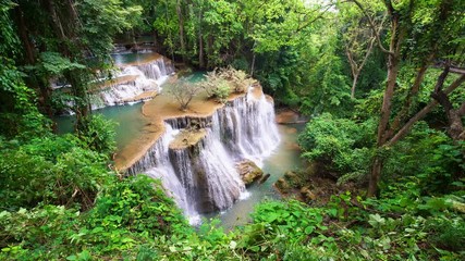 Wall Mural - Waterfall flow standing with forest enviroment from high angle view in thailand, called Huay orHuai mae khamin in Kanchanaburi province, Lockdown.