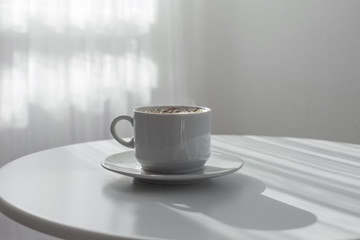 Poster - cup of coffee on white table