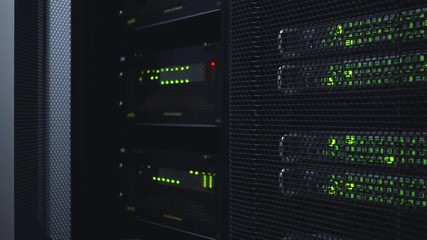 Network server room with racks in data center. Blink Led lamp. Dark server room.