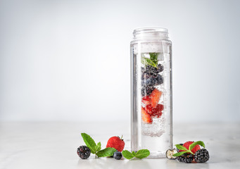 Wall Mural - Infused water in plastic bottle with berries