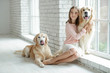 © nuzza11 - Child with a dog. A girl with labradors at home.