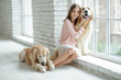 © nuzza11 - Child with a dog. A girl with labradors at home.