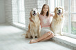 © nuzza11 - Child with a dog. A girl with labradors at home.
