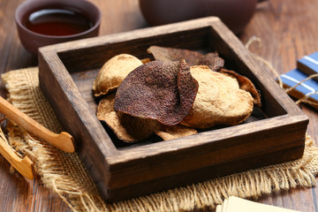 chinese dried tangerine peel in wooden box with tea