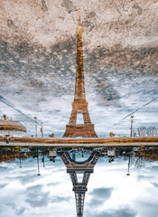 paris eiffel tower's reflection after the rain in paris, france. eiffel tower is one of the most ico
