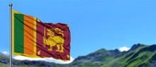 Sri Lanka Flag Waving In The Blue Sky With Green Fields At Mountain Peak Background. Nature Theme.