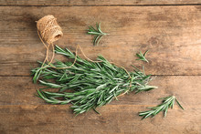 Fresh Rosemary Branches And Twine On Wooden Table, Top View
