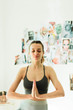 © Дарья Фомина - Young attractive smiling woman practicing yoga in a bright room