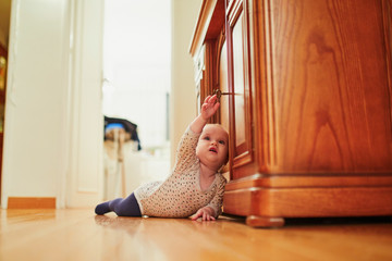 Baby girl learning to crawl