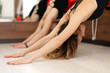 © Kate - woman practicing yoga on ropes stretching in gym. Fit and wellness lifestyle