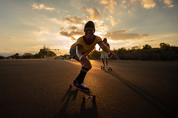 Wall Mural - Skateboarders ride skateboards at night