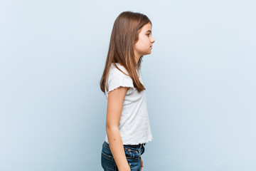 cute girl gazing left, sideways pose.