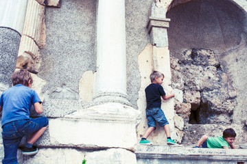 little boy exploring ancient architecture, lifestyle people on summer vacation close up