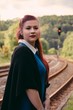 © funkenzauber - Stylish woman waiting at a rural train station