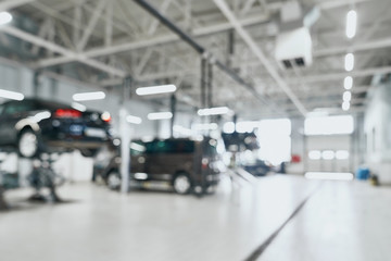 Repair service station with lifted modern cars