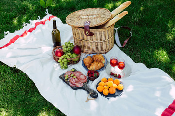 Wall Mural - Summer picnic in the park on the green grass