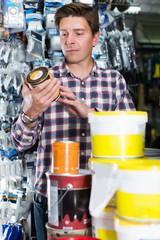 Wall Mural - Worker selling tins of paint