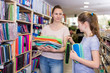 © JackF - Woman with girl in school supplies shop