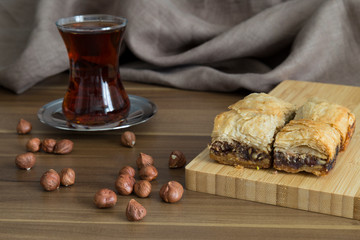 Wall Mural - Turkish style vegan baklava or Antep baklava with nut,date fruit, pistachio for presentation and service and food photography. 