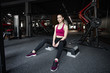 © Anton Gepolov - Close up portrait of young pretty european fitness woman sitting on the step platform at the gym. Breaking relax while exercise workout. Concept of health and sport lifestyle. Athletic Body.