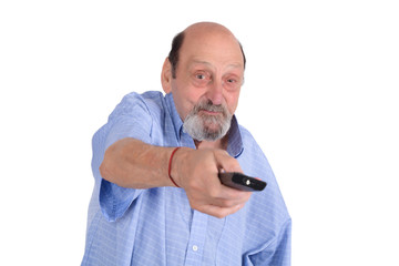 Senior man watching tv with remote control