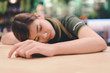 © stcom - Tired woman sleeping at workplace at Lunch break. - Image