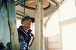 © hideo tsuto - Farmer operating machine