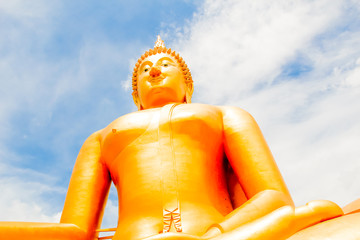 Big Golden Buddha with blue sky blue at Wat Muang, Ang Thong Province, Thailand