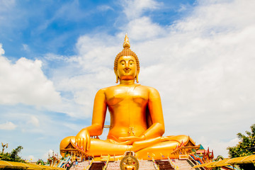 Big Golden Buddha with blue sky blue at Wat Muang, Ang Thong Province, Thailand