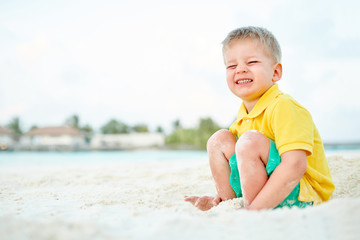 Three year old toddler boy on beach