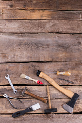 Wall Mural - Different hand tools for construction, top view. Old hand tools set including axe, hammer, screwdriver, wrenches and pliers. Vintage style.