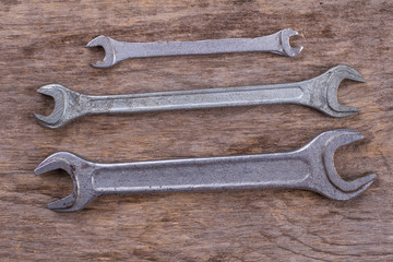 Wall Mural - Wrenches on wooden background. Repair carpenter tools.