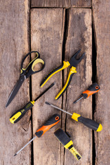 Wall Mural - Set of construction tools, top view. Instruments for construction and repair on old wooden background.