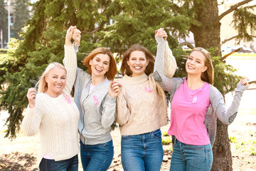 Sticker - Happy women of different ages with pink ribbons outdoors. Breast cancer concept