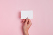 © Diana Vyshniakova - Woman's hand holding blank paper card