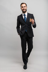 Poster - Full length of an attractive smiling young businessman