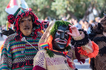 Wall Mural - Masked men (Caretos) at Iberian Mask Festival Parade in Lisbon