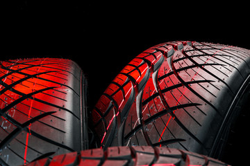 New tyres background. Car tyres close up