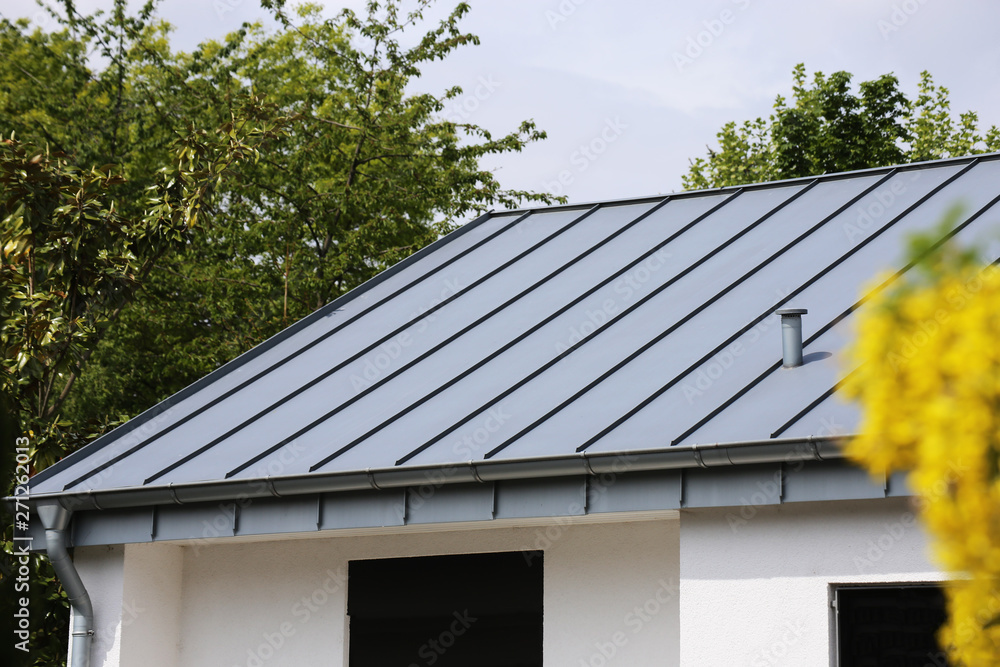 Metal standing seam roof on a residential home - obrazy, fototapety, plakaty 
