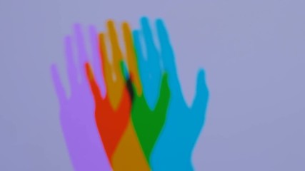 Interactive exposition in science museum. Colored shadows of woman hand. Science, optical and physics concept