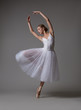 © Yevgeniy - Ballerina dancing in white dress. Color photo.