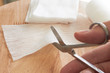 © vachcameraman - Dressing or clean wound tools includes Roll gauze,pile of gauzes and gauze roll cutter or scissors with Hand cut gauze