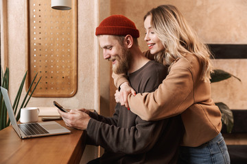 Canvas Print - Happy young stylish couple spending time