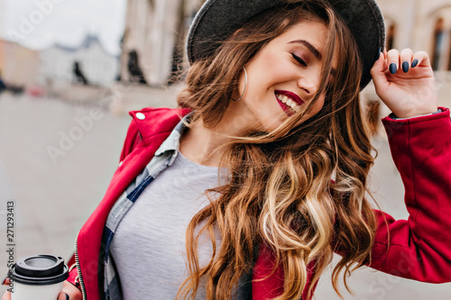 Close Up Portrait Of Fascinating White Woman With Golden Wavy Hair